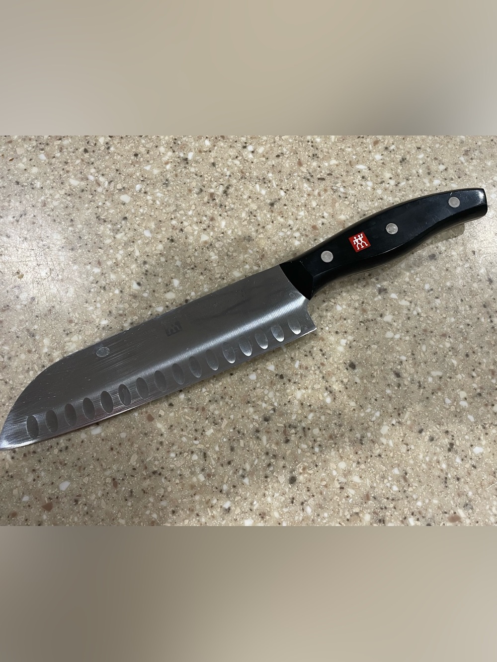 Zwilling J.A. Henckels Twin Signature 7 Inch Santoku Knife Hollow Edge